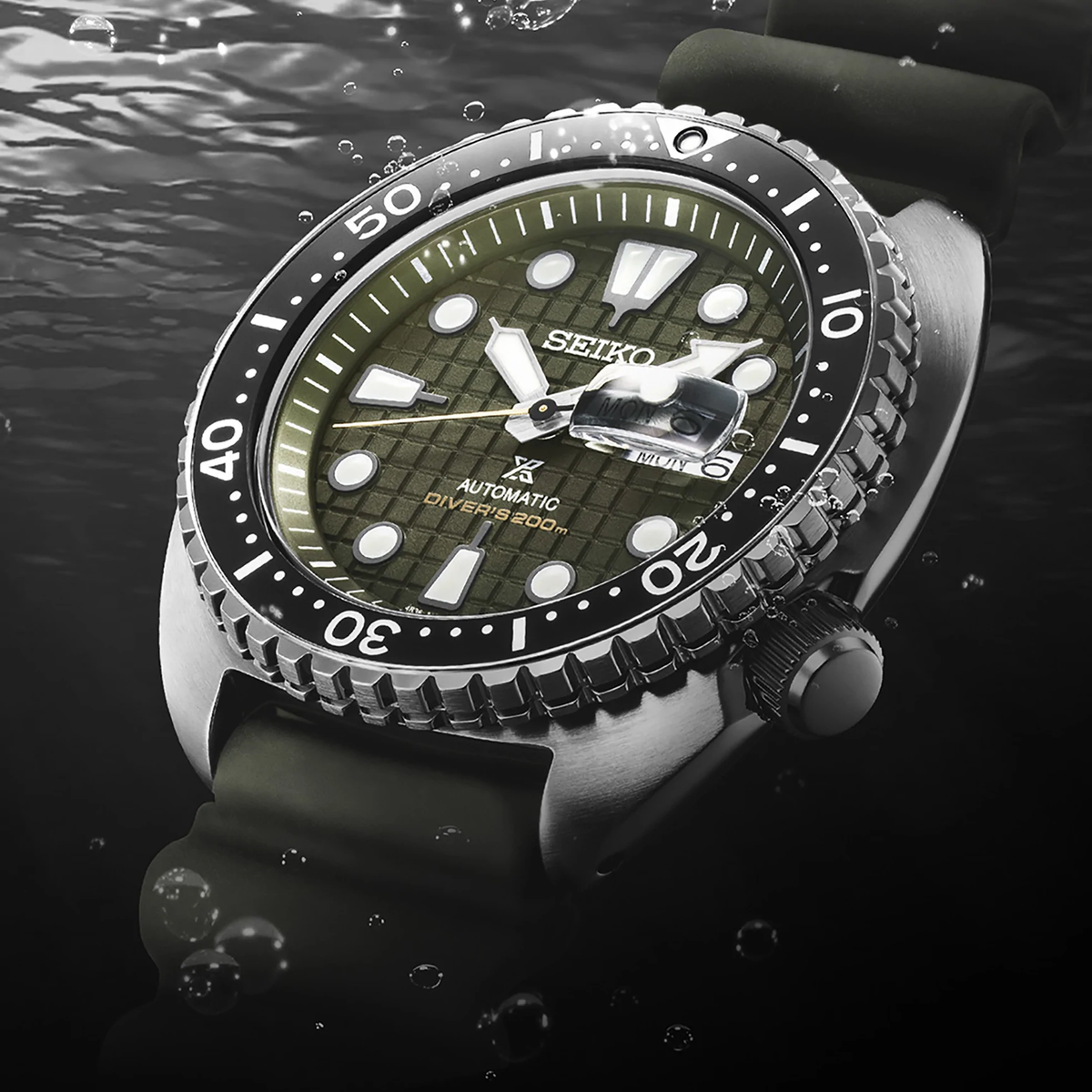 Seiko Prospex SRPE05 men's green dial automatic watch with khaki silicone strap — lifestyle