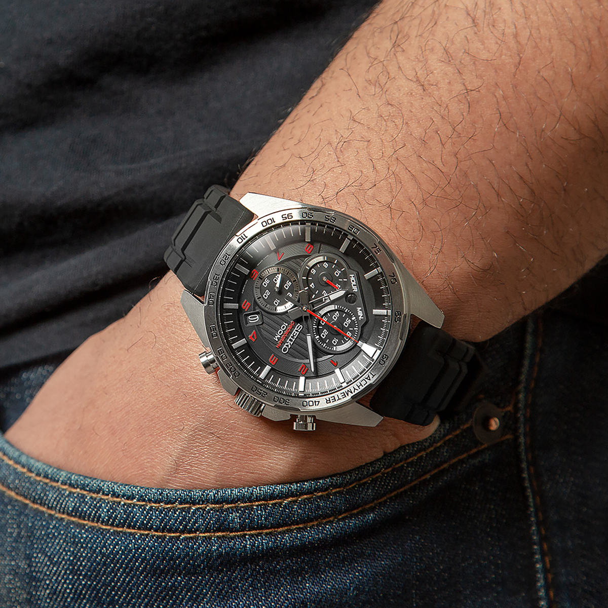 Seiko SSB325 men's quartz chronograph watch with a black silicone strap and black patterned dial. — lifestyle