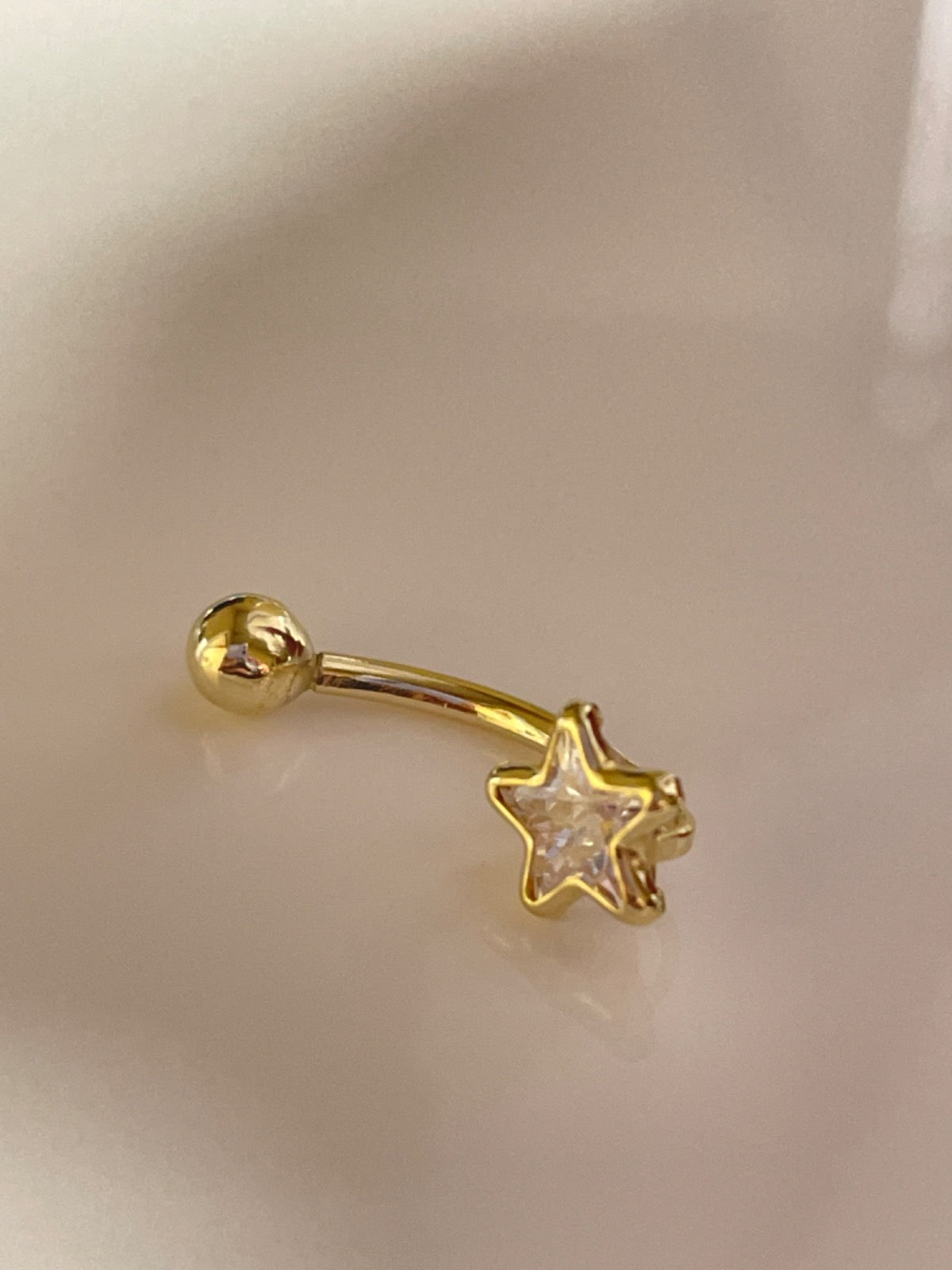 18K Yellow Gold Star Piercing with CZ